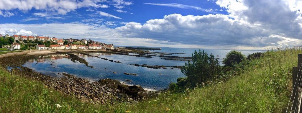 Scenic view of Pittenweem, coastal village in the background. Ideal for travel and tourism enthusiasts exploring Scotland's charming seaside destinations.