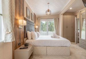 Bedroom inside of a luxury lodge with hot tub
